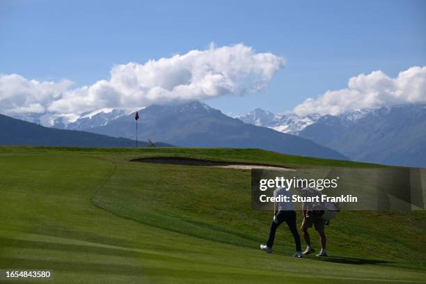 Kalle Samooja of Finland and caddie walk on the seventh hole during Day Three of the Omega European Masters at Crans-sur-Sierre Golf Club on...