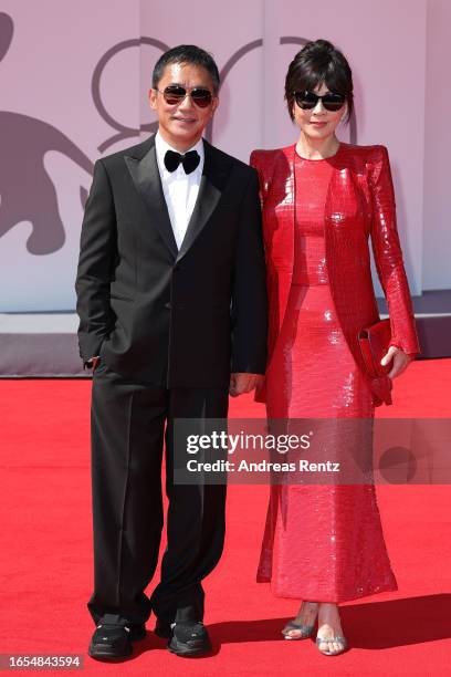 Tony Leung Chiu-Wai and Carina Lau Kar-ling attend the red carpet for the Golden Lion For Lifetime Achievement Award Ceremony at the 80th Venice...