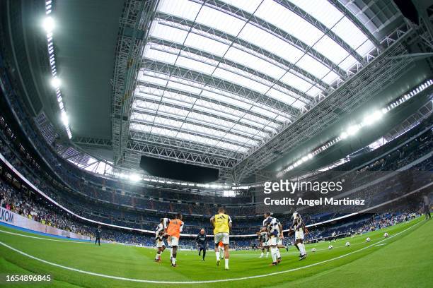 General view inside the stadium as Real Madrid players warm up prior to the LaLiga EA Sports match between Real Madrid CF and Getafe CF at Estadio...
