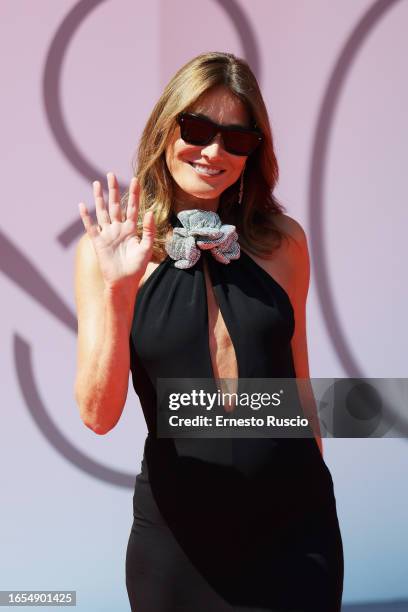 Carla Bruni attends a red carpet for the Golden Lion For Lifetime Achievement Award & "The Lion's Share: A History Of The Mostra" at the 80th Venice...