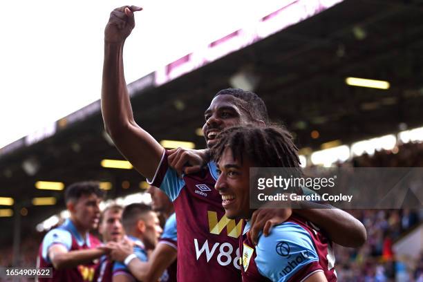 Lyle Foster of Burnley celebrates with teammate Luca Koleosho after scoring the team's first goal during the Premier League match between Burnley FC...
