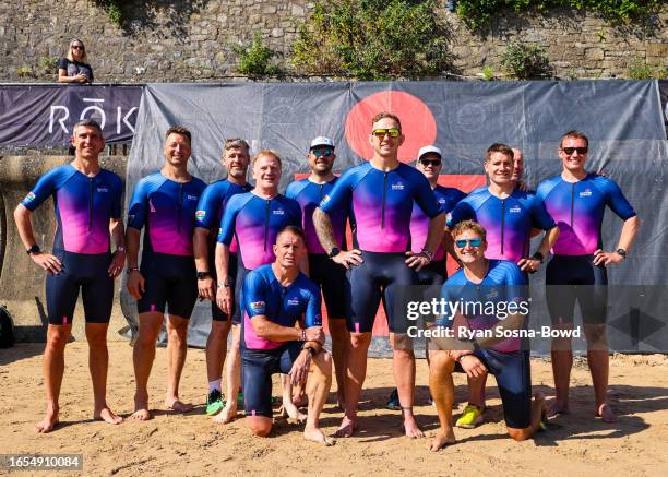 Alix Popham, former Welsh International Rugby Player and Head for Change Ironman Wales team members on Tenby North Beach the day before setting out...