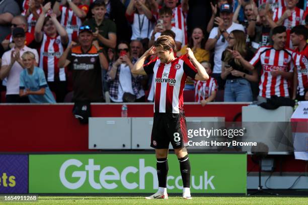 Mathias Jensen of Brentford celebrates after scoring the team's first goal during the Premier League match between Brentford FC and AFC Bournemouth...