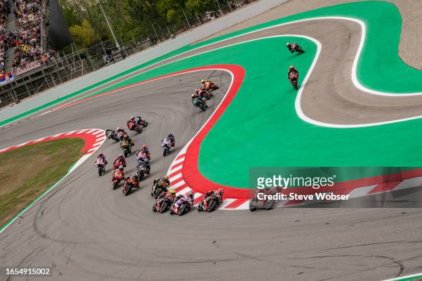 MotoGP riders at turn one after the Sprint start during the Sprint of the MotoGP Gran Premi Monster Energy de Catalunya at Circuit de...