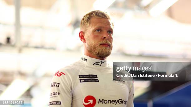 19th placed qualifier Kevin Magnussen of Denmark and Haas F1 looks on in the FIA garage during qualifying ahead of the F1 Grand Prix of Italy at...