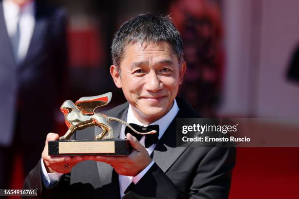 Tony Leung Chiu-wai attends a red carpet for the Golden Lion For Lifetime Achievement Award & "The Lion's Share: A History Of The Mostra" at the 80th...