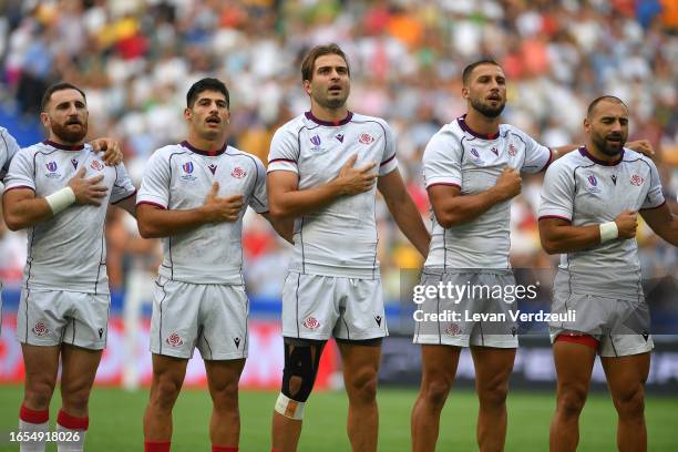 Georgian players Vasil Lobzhanidze, Luka Matkava, Mirian Modebadze, Demur Tapladze and Akaki Tabutsadze perform the national anthem during the Rugby...