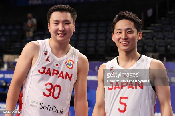 Keisei Tominaga and Yuki Kawamura of Japan pose for a photograph after the FIBA Basketball World Cup Classification 17-32 Group O game between Japan...