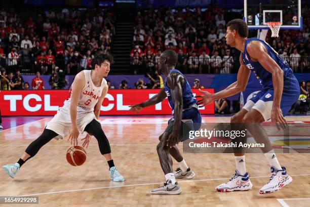 Makoto Hiejima of Japan handles the ball against Anderson Correia and Edy Tavares of Cape Verde during the FIBA Basketball World Cup Classification...