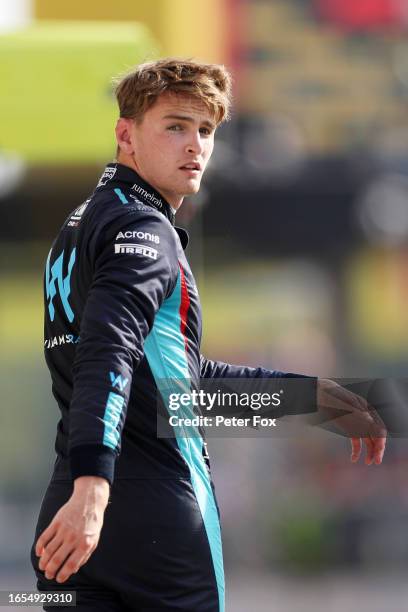 15th placed qualifier Logan Sargeant of United States and Williams walks in the Pitlane during qualifying ahead of the F1 Grand Prix of Italy at...