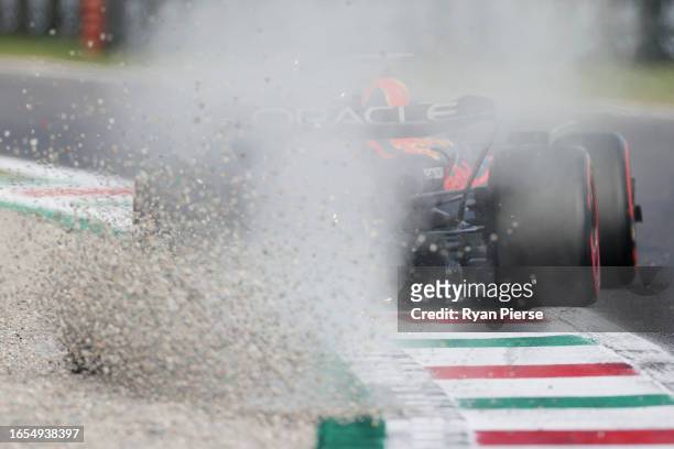 Max Verstappen of the Netherlands driving the Oracle Red Bull Racing RB19 kicks up gravel during qualifying ahead of the F1 Grand Prix of Italy at...
