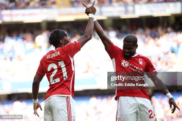 Anthony Elanga of Nottingham Forest celebrates with teammate Serge Aurier of Nottingham Forest after scoring the team's first goal during the Premier...