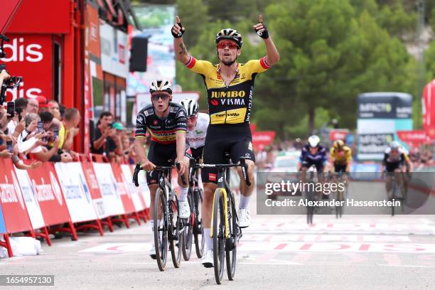 Primoz Roglic of Slovenia and Team Jumbo-Visma celebrates at finish line as stage winner ahead of Remco Evenepoel of Belgium and Team Soudal - Quick...