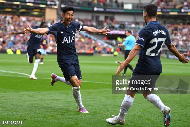 Heung-Min Son of Tottenham Hotspur celebrates with teammate Manor Solomon after scoring the team's fourth goal during the Premier League match...