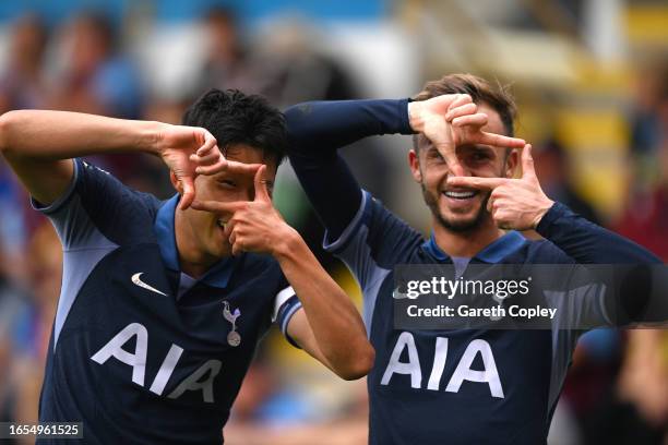 Heung-Min Son of Tottenham Hotspur celebrates with teammate James Maddison after scoring the team's fourth goal during the Premier League match...