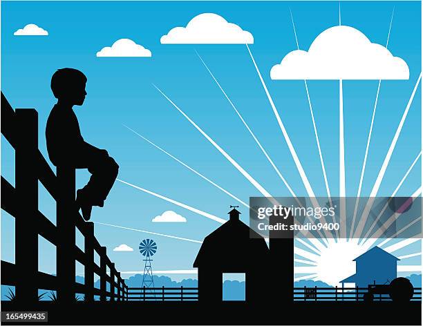 farm boy silhouetted sitting on a fence - farmhouse stock illustrations