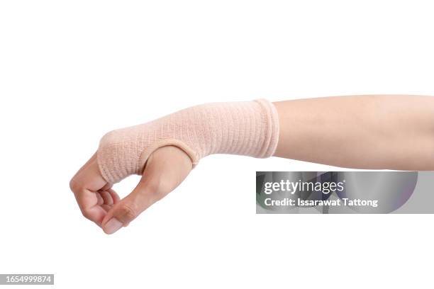 injured painful hand with white gauze bandage. isolated on white background - chronic wound stock pictures, royalty-free photos & images