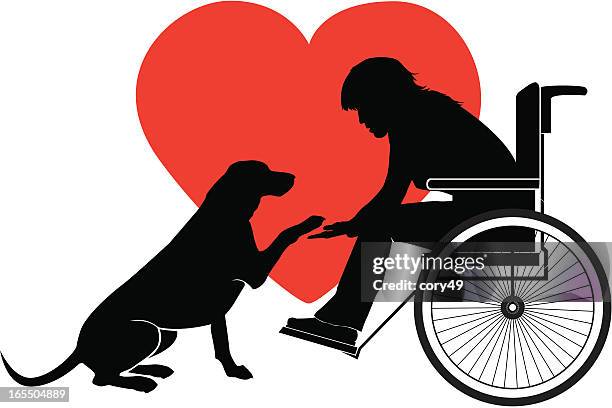 silhouette of dog extending paw to a person in a wheelchair - seeing eye dog stock illustrations