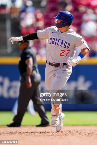 Seiya Suzuki of the Chicago Cubs rounds the bases after hitting a home run in the eighth inning against the Cincinnati Reds during game one of a...