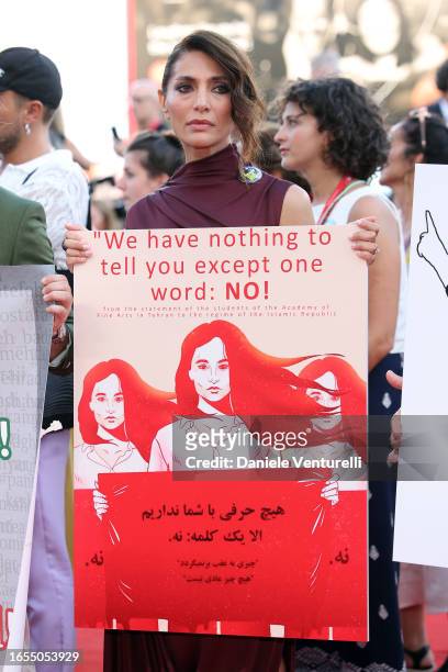 Patroness Caterina Murino attends a Flash Mob in Solidarity With Iranian People After Saeed Roustaee Conviction during the red carpet for the movie...