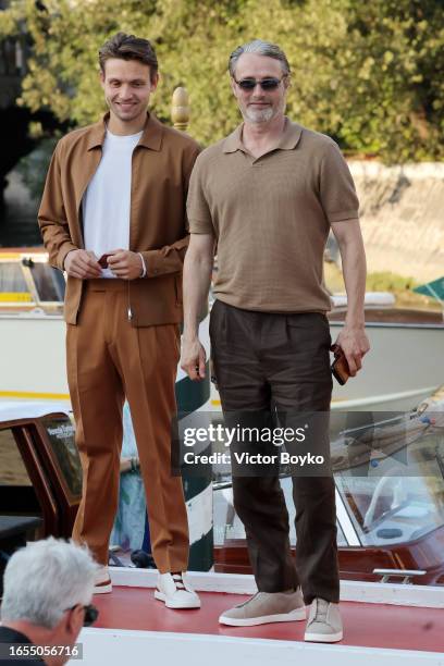 Carl Jacobsen Mikkelsen and Mads Mikkelsen arrive at the 80th Venice International Film Festival 2023 on September 02, 2023 in Venice, Italy.