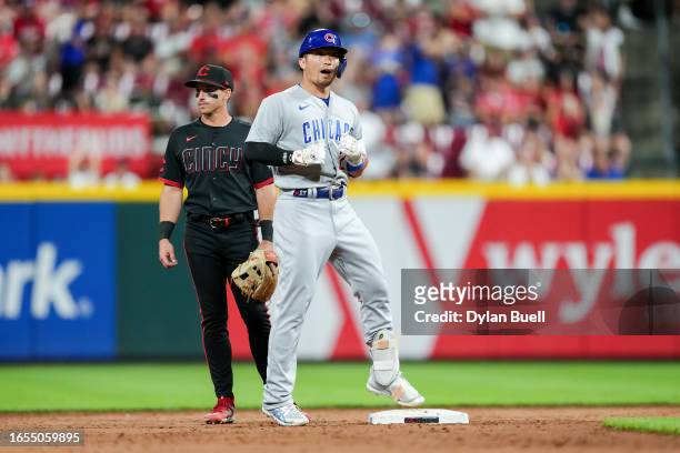 Seiya Suzuki of the Chicago Cubs celebrates after hitting a double in the ninth inning against the Cincinnati Reds during game two of a doubleheader...