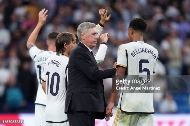Carlo Ancelotti, Head Coach of Real Madrid, shakes hands with Jude Bellingham of Real Madrid after the LaLiga EA Sports match between Real Madrid CF...