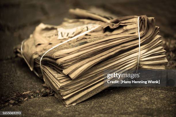 rotten pile of newspapers in sepia tone - old paper stock pictures, royalty-free photos & images