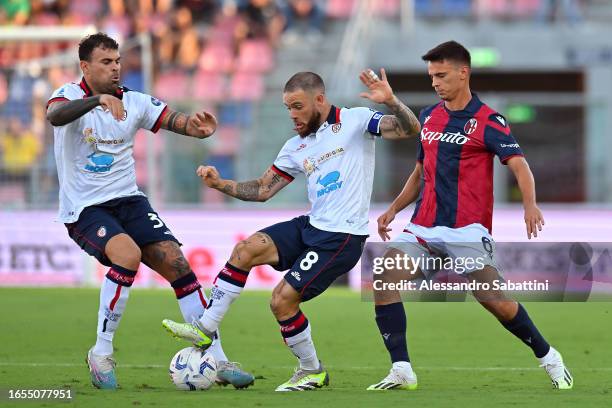 Nahitan Nandez of Cagliari Calcio controls the ball under pressure from Nikola Moro of Bologna during the Serie A TIM match between Bologna FC and...