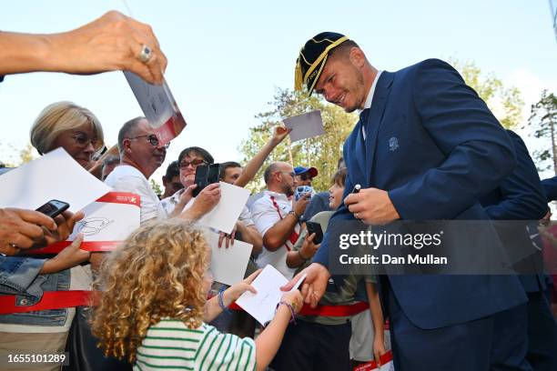 Owen Farrell of England signs an autograph for a young fan during the Rugby World Cup 2023 Welcome Ceremony at Convention Center on September 02,...