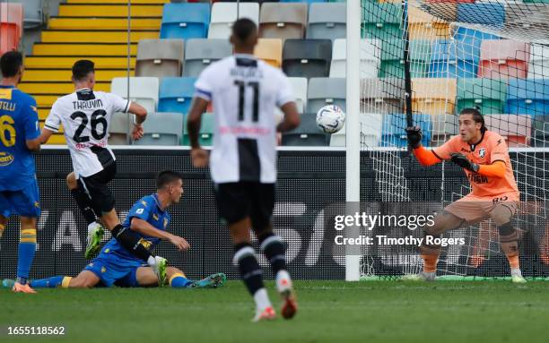 Florian Thauvin of Udinese forces Stefano Turati of Frosinone to make a save during the Serie A TIM match between Udinese Calcio and Frosinone Calcio...