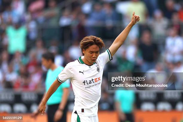 Kou Itakura of Borussia Mönchengladbach celebrates after scoring the team's first goal during the Bundesliga match between Borussia Mönchengladbach...