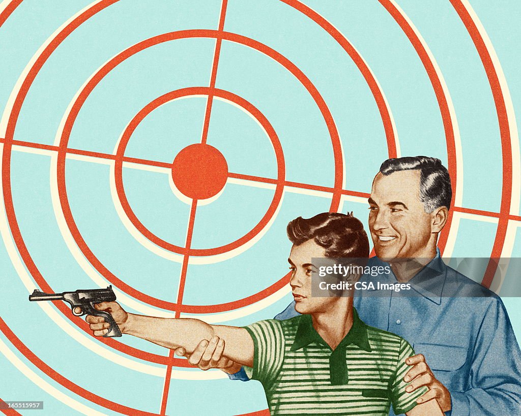 Man and Boy Shooting a Gun