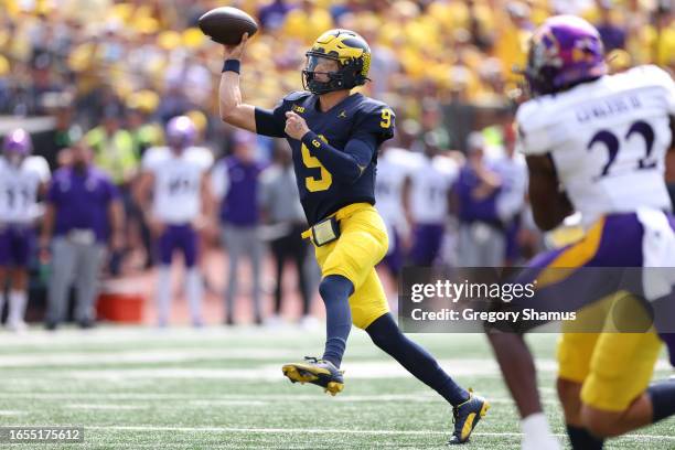 McCarthy of the Michigan Wolverines throws a first quarter touchdown while playing the East Carolina Pirates at Michigan Stadium on September 02,...
