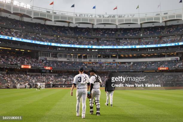 Michael King and Austin Wells of the New York Yankees take the field prior to a game against the Milwaukee Brewers at Yankee Stadium on September 9...
