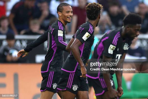 Leroy Sane of Bayern Munich celebrates with teammates after scoring the team's first goal during the Bundesliga match between Borussia...