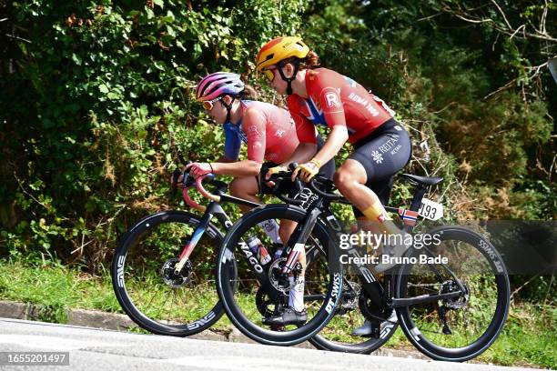 Karolina Kumiega of Poland and UAE Team ADQ and Susanne Andersen of Norway and Uno-X Pro Cycling Team compete in the breakaway during the 22nd GP de...