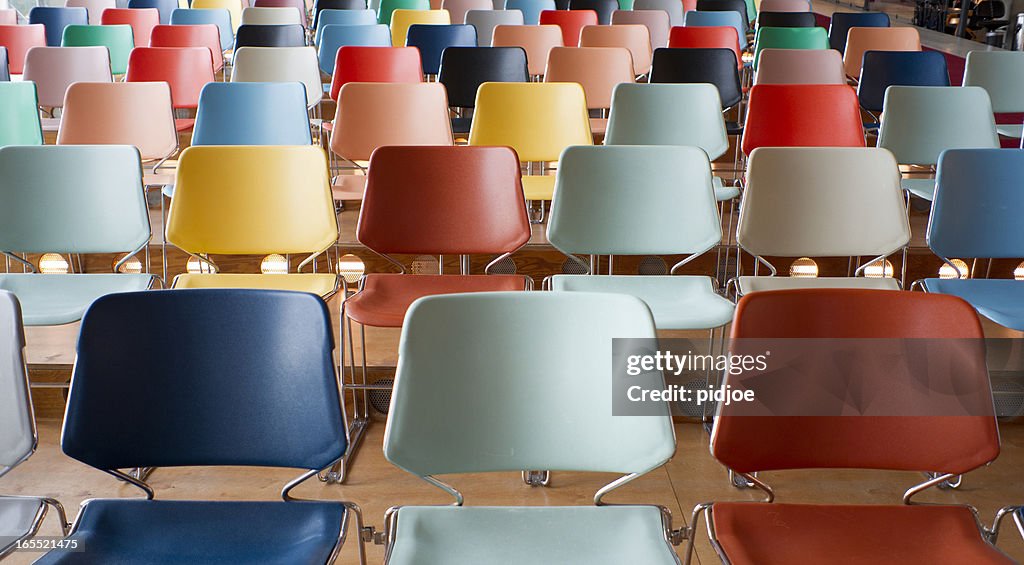 Colorful empty chairs in theater