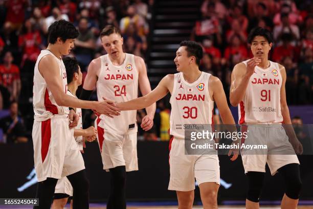 Keisei Tominaga of Japan talks to Yuta Watanabe of Japan during the FIBA Basketball World Cup Classification 17-32 Group O game between Japan and...