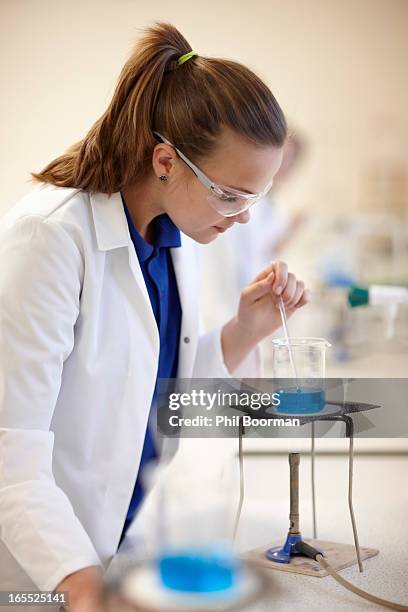 student working in chemistry lab - bunsen burner stock pictures, royalty-free photos & images