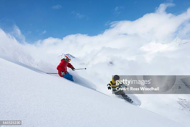 skier and snowboarder on snowy slope - obergurgl stock pictures, royalty-free photos & images