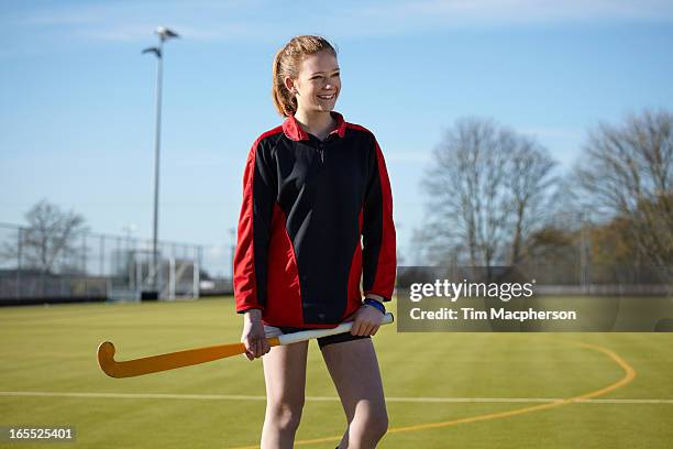 lacrosse player standing on field - female hockey player stock pictures, royalty-free photos & images