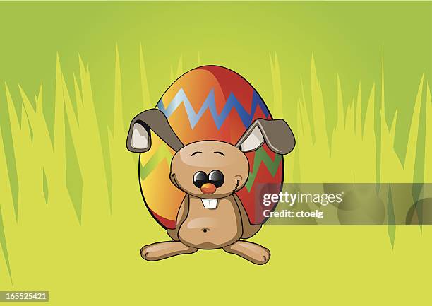 easter bunny with egg - jackrabbit stock illustrations