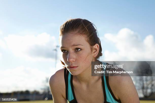 close up of runners serious face - fille sport photos et images de collection