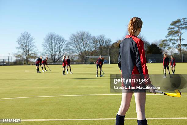 lacrosse player standing in game - hockey equipment stockfoto's en -beelden