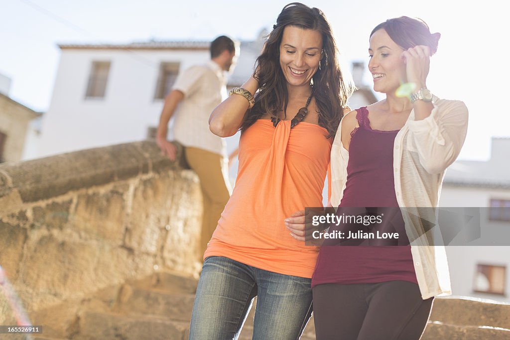 Women walking together on city street