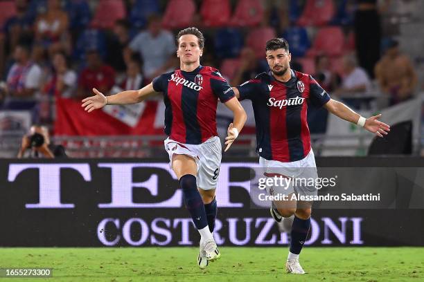 Giovanni Fabbian celebrates after scoring the team's second goal with teammate Riccardo Orsolini of Bologna during the Serie A TIM match between...