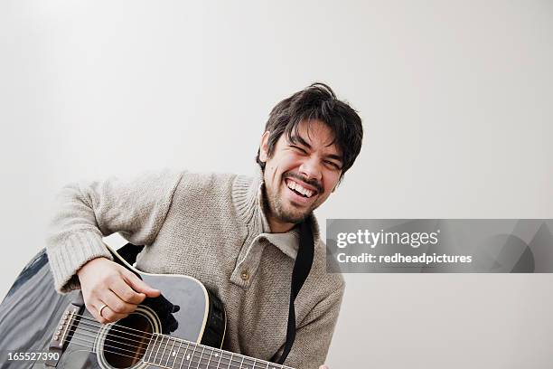 man playing guitar outdoors - acoustic guitar white background stock pictures, royalty-free photos & images