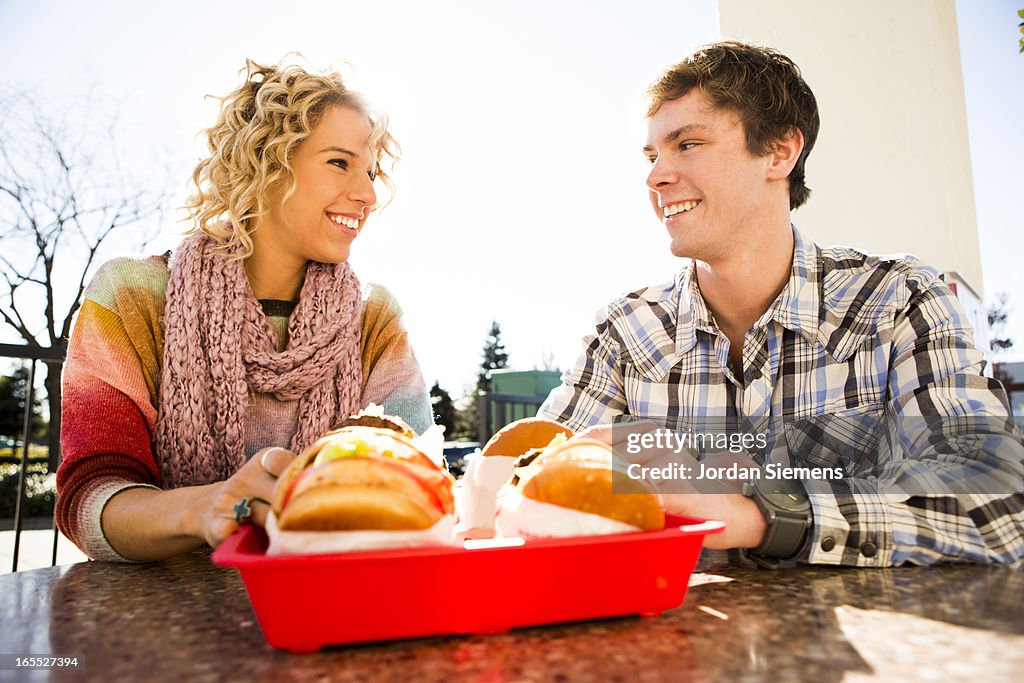 Eating fast food hamburgers