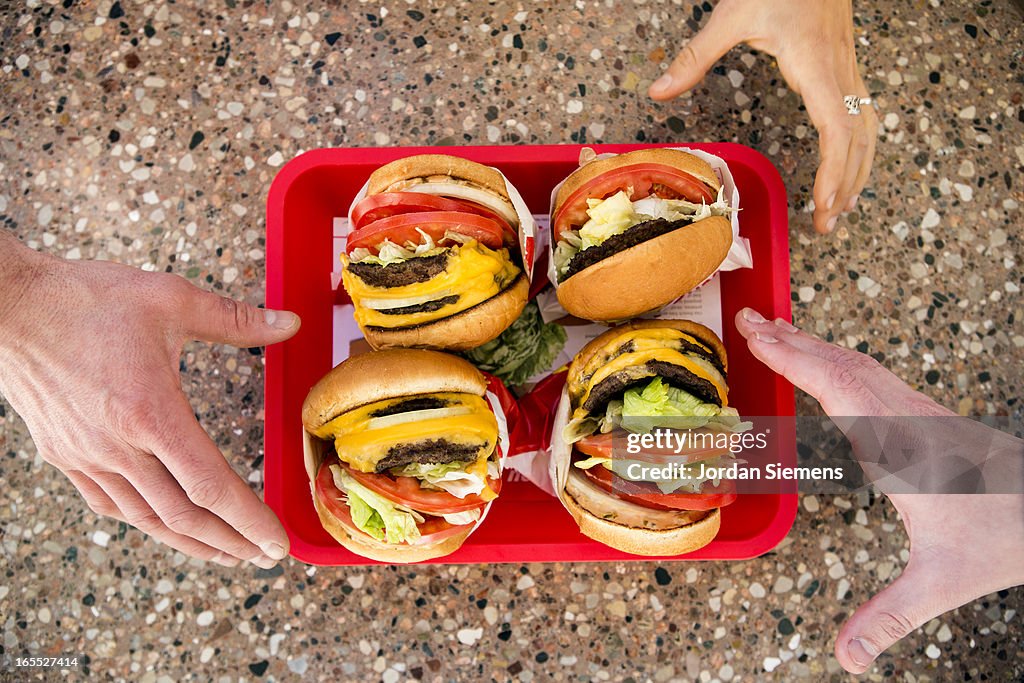 Eating fast food hamburgers